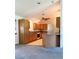 Another angle of the kitchen featuring wood cabinets and ceiling fan at 504 W 7Th St, Frostproof, FL 33843