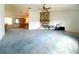 Large living room featuring stone fireplace and ceiling fan at 504 W 7Th St, Frostproof, FL 33843
