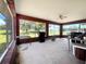 Spacious screened-in patio with brick walls and views of the backyard at 504 W 7Th St, Frostproof, FL 33843