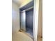 Bathroom shower featuring blue tile and glass sliding door at 504 W 7Th St, Frostproof, FL 33843