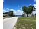 Scenic street view leading to a lake, showcasing the desirable neighborhood and natural beauty at 504 W 7Th St, Frostproof, FL 33843