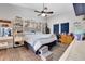 Bedroom with a ceiling fan and large window at 505 8Th S St, Dundee, FL 33838