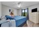 Bedroom featuring hardwood floors, a dresser and a window at 505 8Th S St, Dundee, FL 33838