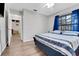 Bedroom with hardwood floors and a large window with curtains at 505 8Th S St, Dundee, FL 33838
