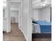 View of a bedroom showing the flooring, ceiling fan and doorway at 505 8Th S St, Dundee, FL 33838