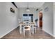 Dining room area featuring a long wooden table, chairs, and decorative lighting at 505 8Th S St, Dundee, FL 33838