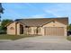 Charming single-Gathering home with a two-car garage, manicured lawn and inviting curb appeal at 505 8Th S St, Dundee, FL 33838