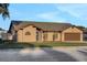 Inviting single-story home with a neatly landscaped front yard and a dark blue front door at 505 8Th S St, Dundee, FL 33838