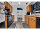 Functional kitchen with wood cabinets and modern appliances at 505 8Th S St, Dundee, FL 33838