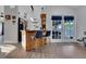 Modern kitchen featuring bar seating, wood accents, and view of the outdoor patio at 505 8Th S St, Dundee, FL 33838