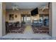 Covered patio with ceiling fans, ample seating, and an outdoor TV, ideal for relaxing at 505 8Th S St, Dundee, FL 33838