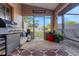 Cozy covered patio featuring a grill, seating area, and view of the spacious backyard at 505 8Th S St, Dundee, FL 33838