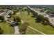 Aerial view of a golf course featuring lush green fairways and mature trees at 5102 Village Ct # E-2, Lake Wales, FL 33898