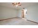 Spacious bedroom with a ceiling fan and an attached bathroom for added convenience at 5102 Village Ct # E-2, Lake Wales, FL 33898