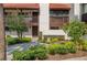 Charming two-story condo features a beautiful red tile roof and lush landscaping at 5102 Village Ct # E-2, Lake Wales, FL 33898