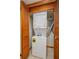 Stacked washer and dryer unit in a closet with louvered doors at 5102 Village Ct # E-2, Lake Wales, FL 33898
