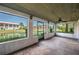 Relaxing screened patio with views of a lake and well-maintained landscaping at 5102 Village Ct # E-2, Lake Wales, FL 33898