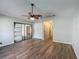 This bedroom has modern wood-look tile flooring and 2 closets at 560 Saint Andrews Rd, Winter Haven, FL 33884