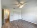 The bedroom features a ceiling fan, closet, and adjacent bathroom at 560 Saint Andrews Rd, Winter Haven, FL 33884