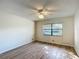 Bright bedroom with ceiling fan and natural light at 560 Saint Andrews Rd, Winter Haven, FL 33884