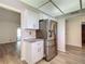 The kitchen features new appliances and bright lighting at 560 Saint Andrews Rd, Winter Haven, FL 33884