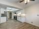 Modern kitchen featuring white cabinets, stainless steel appliances, and stylish tile floors at 560 Saint Andrews Rd, Winter Haven, FL 33884