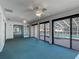 This sunroom features an exterior view of the pool and sliding doors at 560 Saint Andrews Rd, Winter Haven, FL 33884