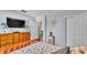 Well-lit bedroom with dresser, closet, and serene decor creates a relaxing atmosphere at 616 Oriole Dr, Lakeland, FL 33803