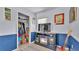This bedroom has a fireplace, closet, and a painting of the ocean at 616 Oriole Dr, Lakeland, FL 33803