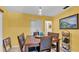 Cozy dining room with tile floors, updated lighting, and decor at 616 Oriole Dr, Lakeland, FL 33803