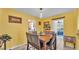 Cozy dining room with tile floors, updated lighting, and decor at 616 Oriole Dr, Lakeland, FL 33803