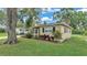 Cozy home with black shutters, and pretty landscaping at 616 Oriole Dr, Lakeland, FL 33803