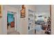 Hallway with shelving leading to the living room and other bedrooms at 616 Oriole Dr, Lakeland, FL 33803