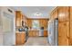 Bright kitchen with stainless steel appliances, custom cabinets, and mosaic tile backsplash at 616 Oriole Dr, Lakeland, FL 33803