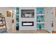 Beautiful living room with custom fireplace, modern finishes, and stylish decorations at 616 Oriole Dr, Lakeland, FL 33803
