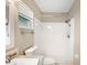 This bathroom features a walk-in shower, granite countertops, and white cabinets at 630 Heather Glen Loop, Winter Haven, FL 33884