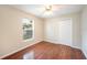 Bedroom features laminate flooring, a ceiling fan and natural light at 630 Heather Glen Loop, Winter Haven, FL 33884