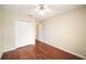 This bedroom features a ceiling fan, closet, and hardwood flooring at 630 Heather Glen Loop, Winter Haven, FL 33884