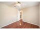 Bedroom featuring laminate floors, a ceiling fan and an attached bathroom at 630 Heather Glen Loop, Winter Haven, FL 33884