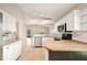 Open concept kitchen featuring stainless appliances, updated countertops, and light-filled space at 630 Heather Glen Loop, Winter Haven, FL 33884