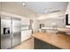 Updated kitchen with stainless appliances, wooden island, and spacious layout at 630 Heather Glen Loop, Winter Haven, FL 33884