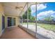 This screened-in patio has a ceiling fan and a view of the fenced-in backyard at 630 Heather Glen Loop, Winter Haven, FL 33884