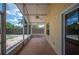 The screened-in patio has a ceiling fan and a view of the fenced-in backyard at 630 Heather Glen Loop, Winter Haven, FL 33884