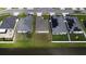 A high-angle view shows the property surrounded by neighboring houses and ponds at 648 Lorient Dr, Eagle Lake, FL 33839