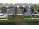 This overhead shot displays the rear of the home with a retention pond nearby at 648 Lorient Dr, Eagle Lake, FL 33839