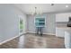 Cozy breakfast nook with natural light and stylish light fixture at 648 Lorient Dr, Eagle Lake, FL 33839