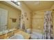 Full bathroom featuring a tub/shower combo, vanity, and framed mirror above a clean white sink at 713 Overlook Grove Dr, Winter Haven, FL 33884