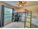 Cozy bedroom featuring a loft bed with a desk and large window offering plenty of natural light at 713 Overlook Grove Dr, Winter Haven, FL 33884