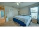 Comfortable bedroom featuring a large closet, ceiling fan, and natural light from the window at 713 Overlook Grove Dr, Winter Haven, FL 33884