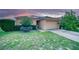 Charming single-story home with a two-car garage, landscaped front yard, and well-maintained lawn at 713 Overlook Grove Dr, Winter Haven, FL 33884